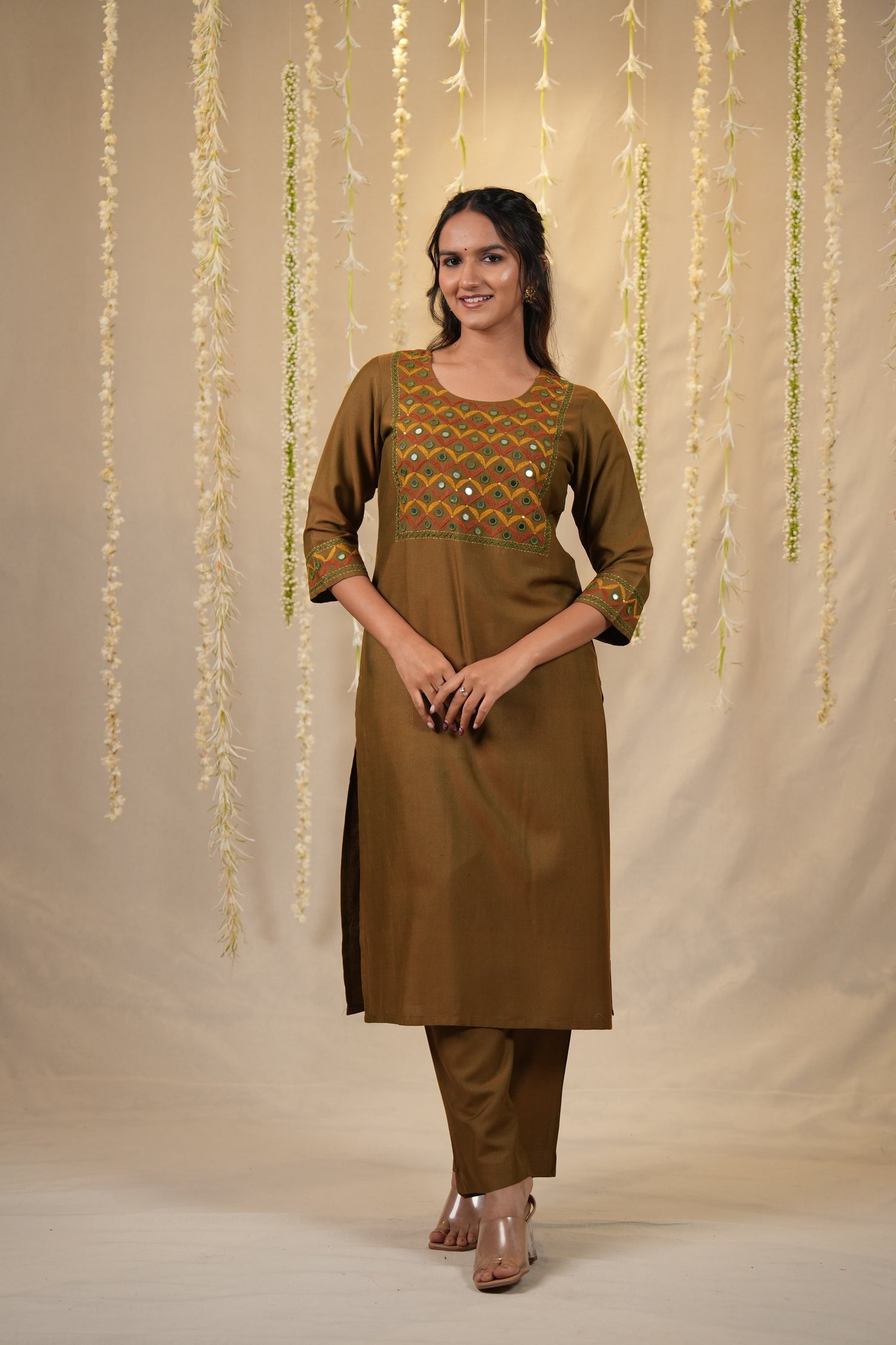 Woman wearing a mehandi colored kurta