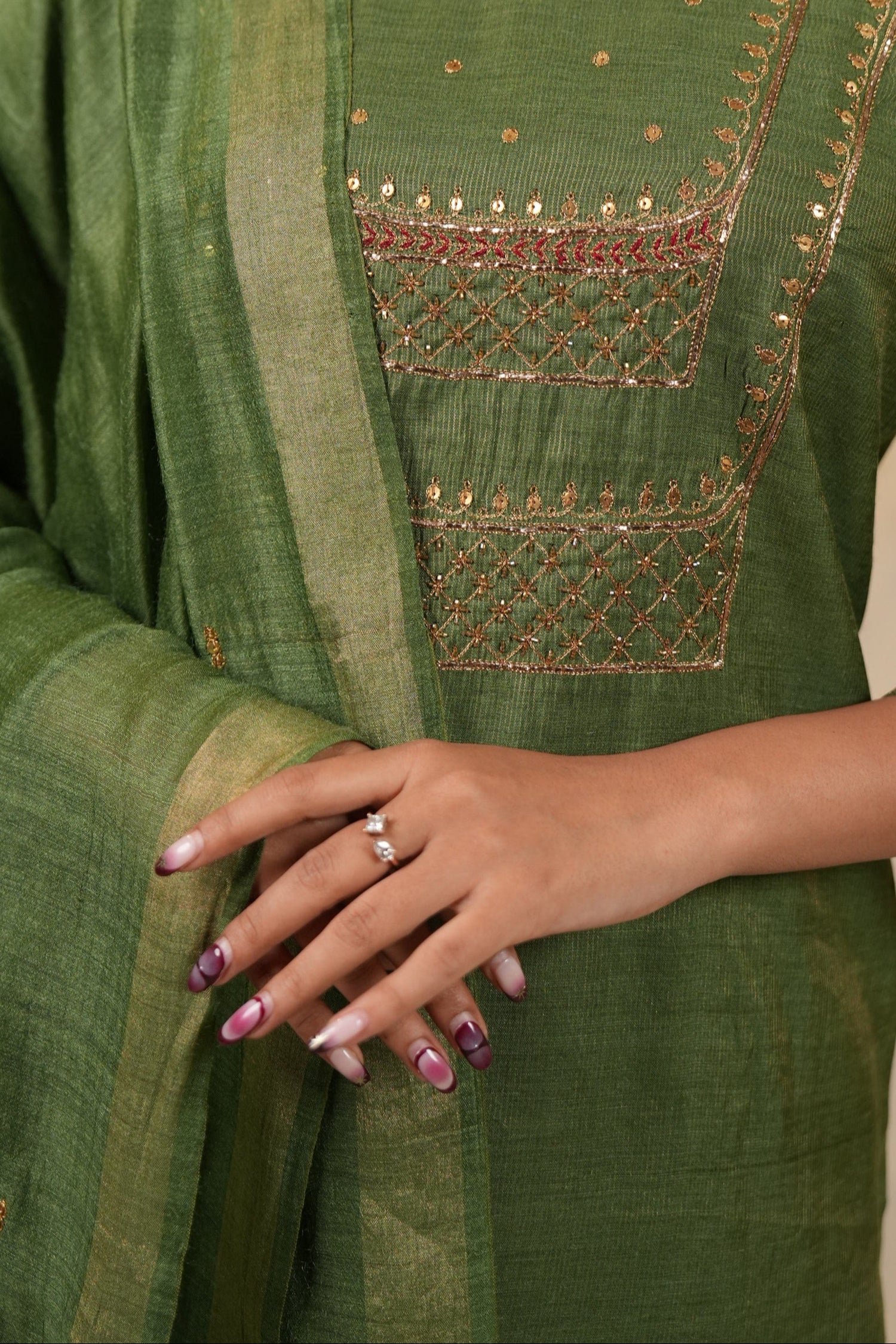 Green traditional outfit with gold embroidery work for indian tyohar